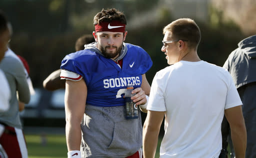 Oklahoma quarterback Baker Mayfield takes a breather after he participated in drills during a practice on Friday. (AP)