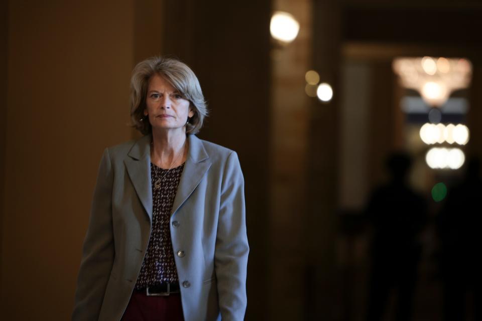 Sen. Lisa Murkowski, R-Alaska, walks to the Senate chambers for a vote at the Capitol Oct. 21.