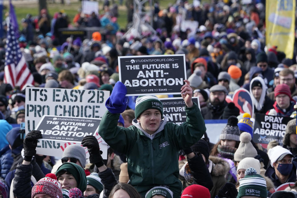 People attend the March for Life rally on the National Mall in Washington, Friday, Jan. 21, 2022. The March for Life, for decades an annual protest against abortion, arrives this year as the Supreme Court has indicated it will allow states to impose tighter restrictions on abortion with a ruling in the coming months. (AP Photo/Susan Walsh)