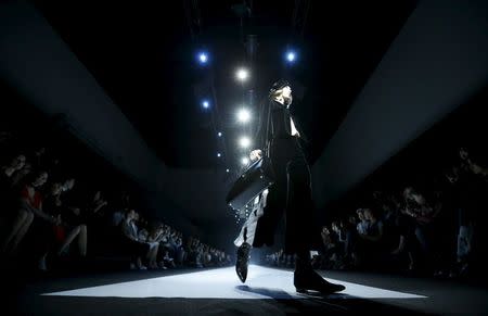 A model present a creation from the Giorgio Armani Autumn/Winter 2016 women's collection during a fashion show in Moscow, Russia, April 14, 2016. REUTERS/Maxim Zmeyev