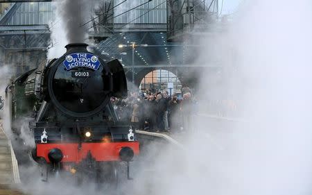 The Flying Scotsman steam engine leaves Kings Cross station in London, February 25, 2016. REUTERS/Paul Hackett