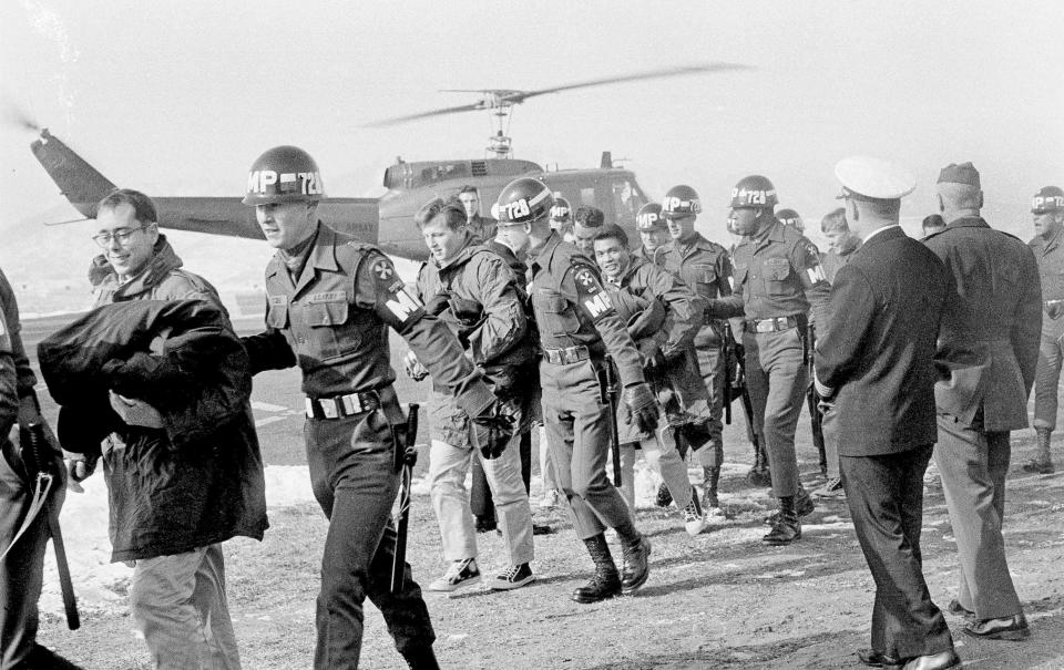 Released crewmen of the USS Pueblo are escorted by MPs upon their arrival at the U.S. Army 121st  Evacuation Hospital at Ascom City, 10 miles west of Seoul, Dec. 23, 1968. / Credit: / AP