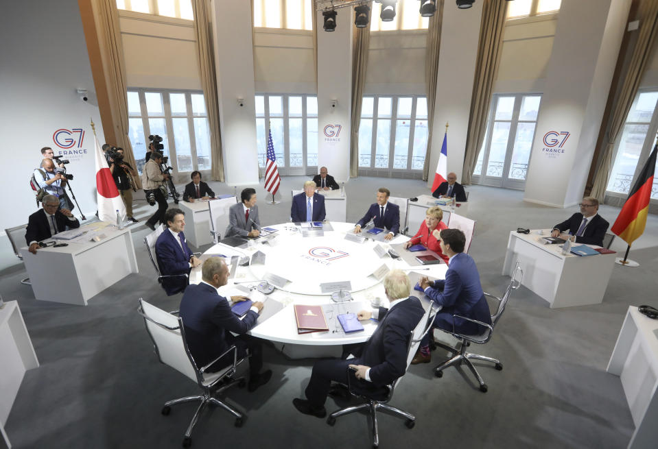 World Leaders prepare to start a working session on World Economy and Trade on the second day of the G-7 summit in Biarritz, France Sunday, Aug. 25, 2019. They are from clockwork top center: President Donald Trump, French President Emmanuel Macron, German Chancellor Angela Merkel, Canadian Prime Minister Justin Trudeau, Britain's Prime Minister Boris Johnson, President of the European Council Donald Tusk, Italian Premier Giuseppe Conte and Japanese Prime Minister Shinzo Abe. (AP Photo/Markus Schreiber)