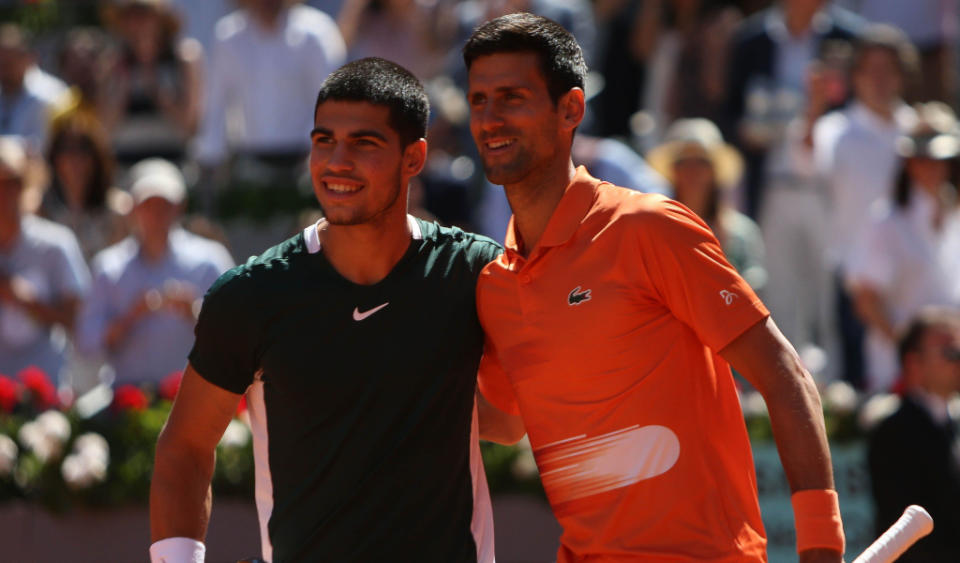 Carlos Alcaraz and Novak Djokovic pose Credit: Alamy