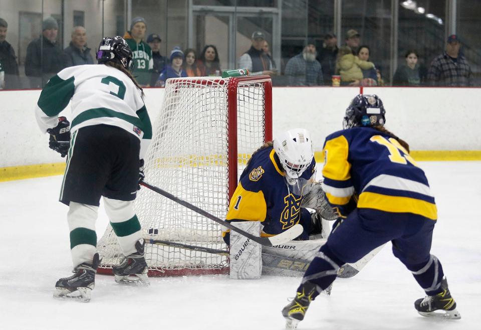 Captain McKenna Colella slips the puck past MC goalie Danielle DeJon. The Duxbury girls hockey team hosted Malden Catholic at The Bog in Kingston winning in a 4-2 decision on Wednesday March 8, 2023 
