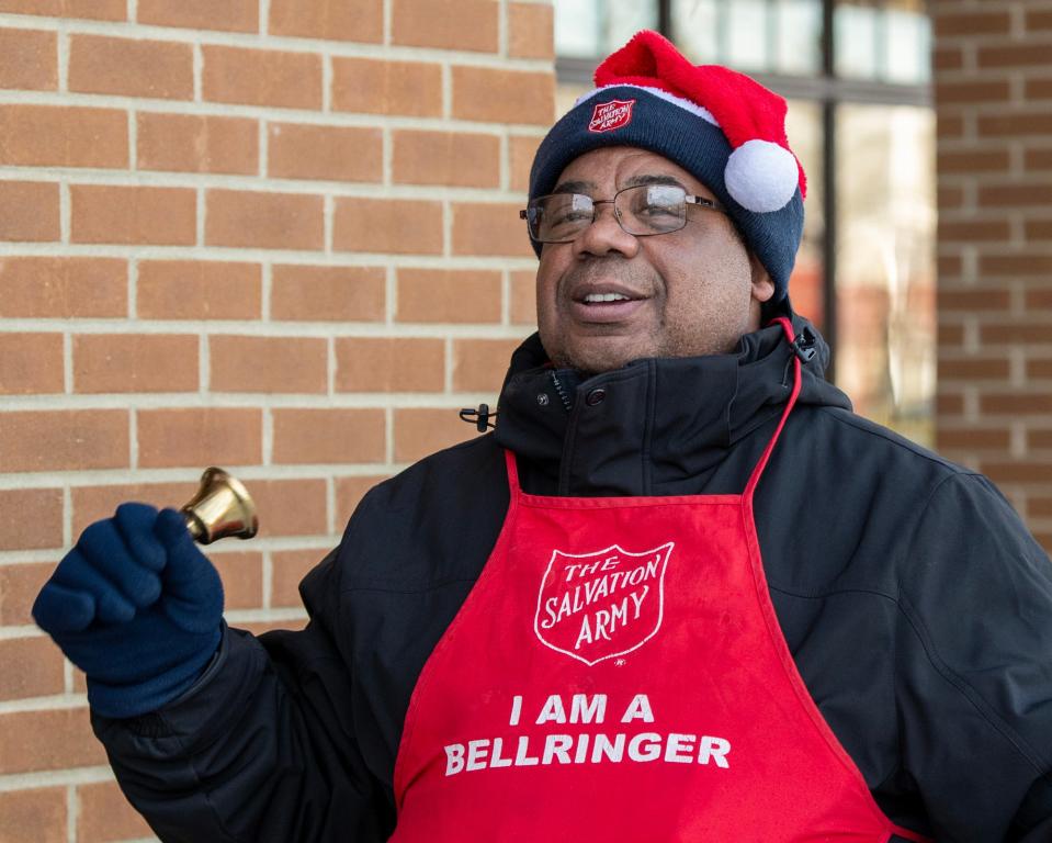 Keith Bryant Sr. rings his bell between songs outside Roche Bros. Supermarket Friday in Westborough.