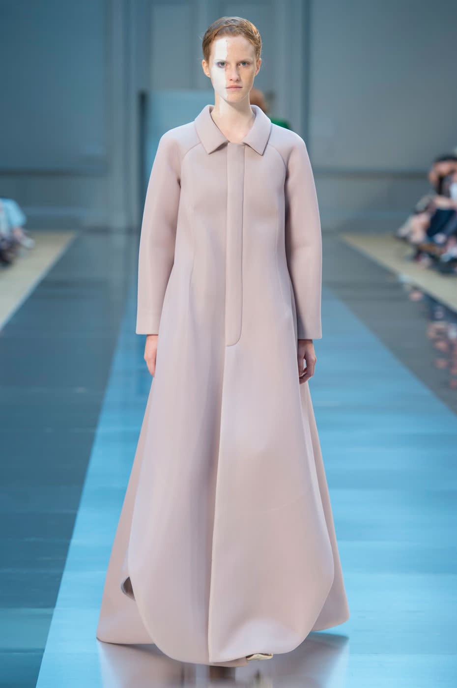 We love how Galliano can go from space aged to monastic designs within the same collection. Here, he shows a mauve-colored coat that would be great for visiting the Vatican.