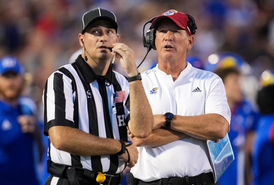 Kansas football head coach Lance Leipold talks with an official during the first half of a Sept. 2, 2022 game against Tennessee Tech at David Booth Kansas Memorial Stadium.