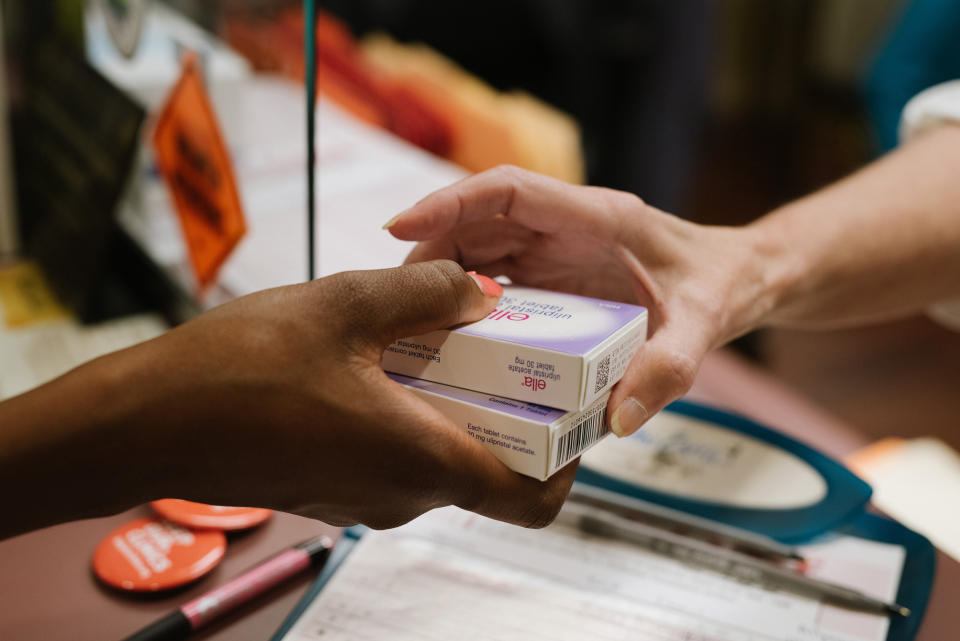 Tina Collins hands out ella, an emergency contraception, on July 22.<span class="copyright">Lucy Garrett for TIME</span>