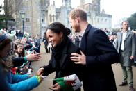 <p>During their first trip to Wales as a couple, Prince Harry helped guide his bride-to-be around the crowds as they visited royal fans, January 2018.</p>