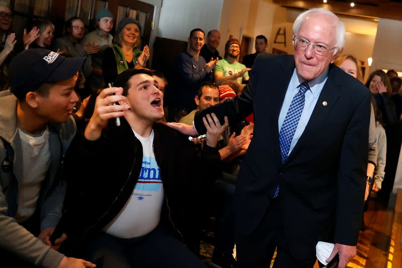 Democratic U.S. presidential candidate Senator Bernie Sanders greets supporters as he arrives at a campaign stop in Plymouth