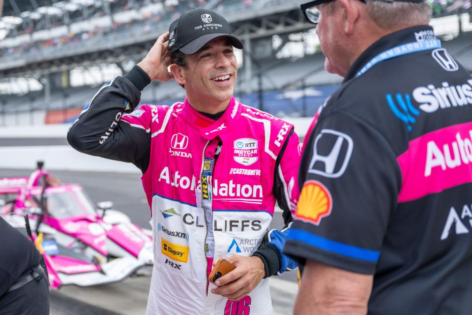 Meyer Shank Racing's Helio Castroneves shares a moment with his crew after his qualifying run at the Indianapolis Motor Speedway.