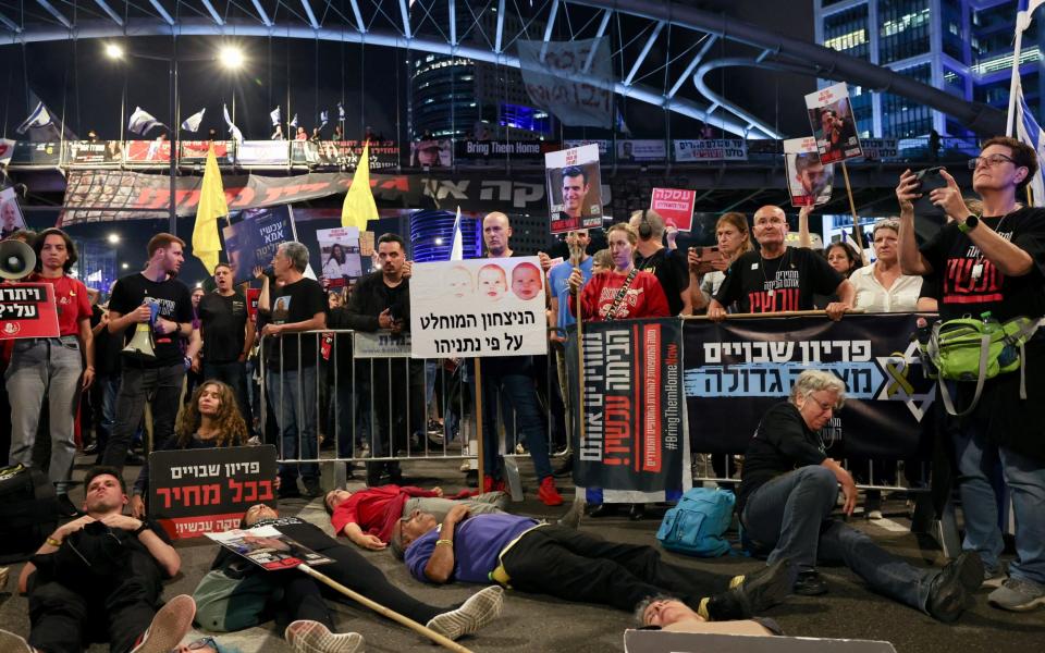 Protesters block a highway demanding the immediate release of hostages who were kidnapped during the deadly October 7 attack, amid the ongoing conflict in Gaza between Israel and Palestinian Islamist group Hamas, in Tel Aviv, Israel, May 6, 2024