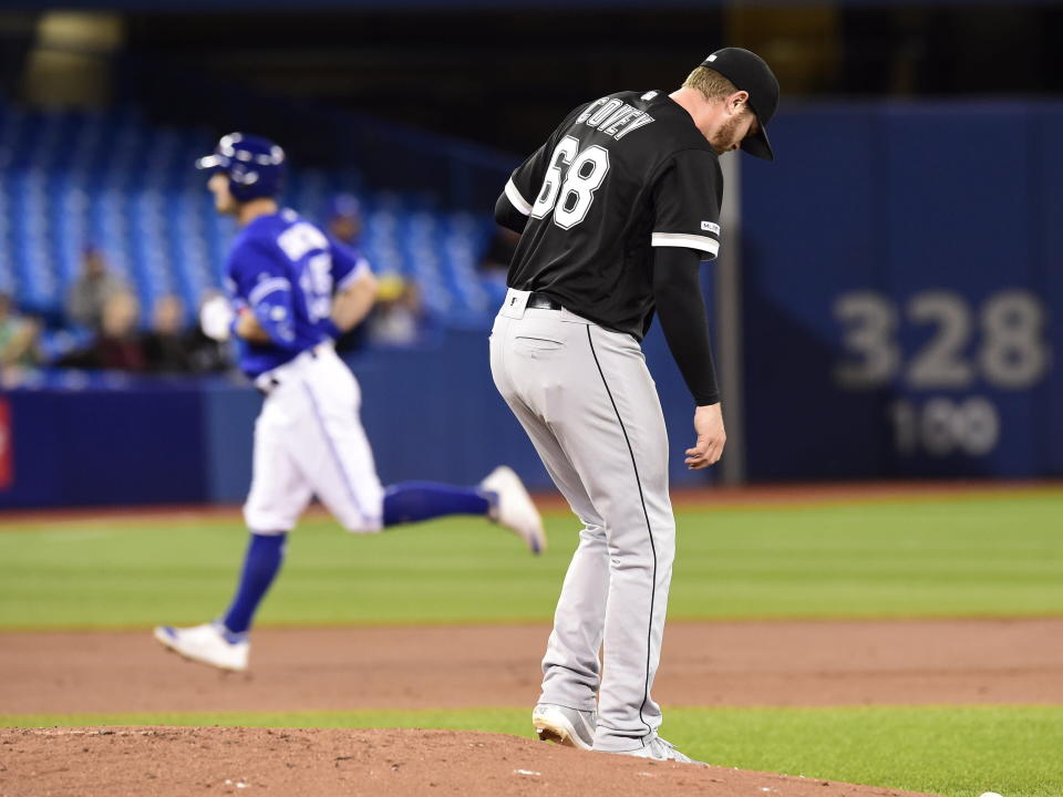 Chicago White Sox starting pitcher Dylan Covey (68) looks down as Toronto Blue Jays' Randal Grichuk (15) rounds the bases after hitting a three-run home run during the first inning of a baseball game Friday, May 10, 2019, in Toronto. (Frank Gunn/The Canadian Press via AP)