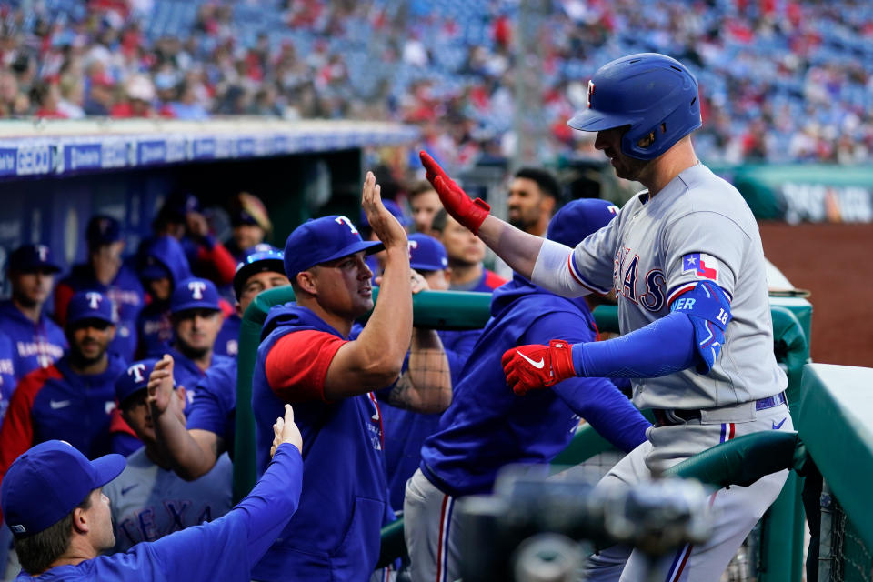 Texas Rangers' Mitch Garver celebrates with teammates after hitting a home run off Philadelphia Phillies' Ranger Suarez during the first inning of a baseball game Tuesday, May 3, 2022, in Philadelphia. (AP Photo/Matt Rourke)