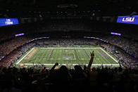 Fans cheer before a NCAA College Football Playoff national championship game between Clemson and LSU Monday, Jan. 13, 2020, in New Orleans. (AP Photo/Eric Gay)