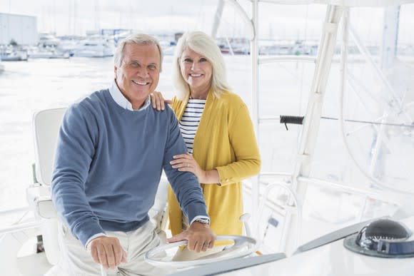 An elderly couple on a boat.