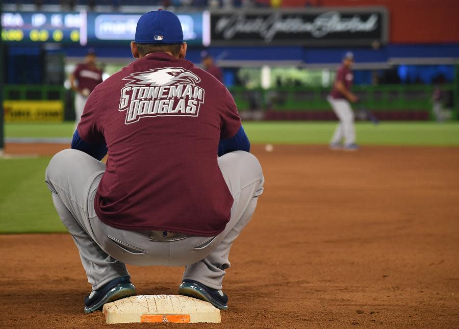 MLB teams wearing Marjory Stoneman Douglas High School caps at