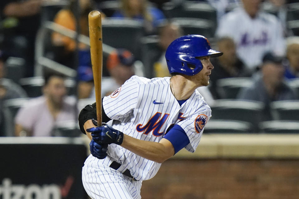 New York Mets' Jacob deGrom (48) follows through on a two-run single during the fifth inning of a baseball game against the San Diego Padres, Friday, June 11, 2021, in New York. (AP Photo/Frank Franklin II)