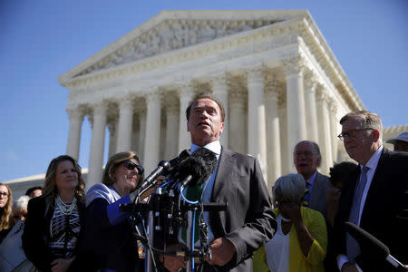 Actor and former California Governor Arnold Schwarzenegger speaks after oral arguments in Gill v. Whitford and to call for an end to partisan gerrymandering in electoral districts at the Supreme Court in Washington, U.S., October 3, 2017. REUTERS/Joshua Roberts