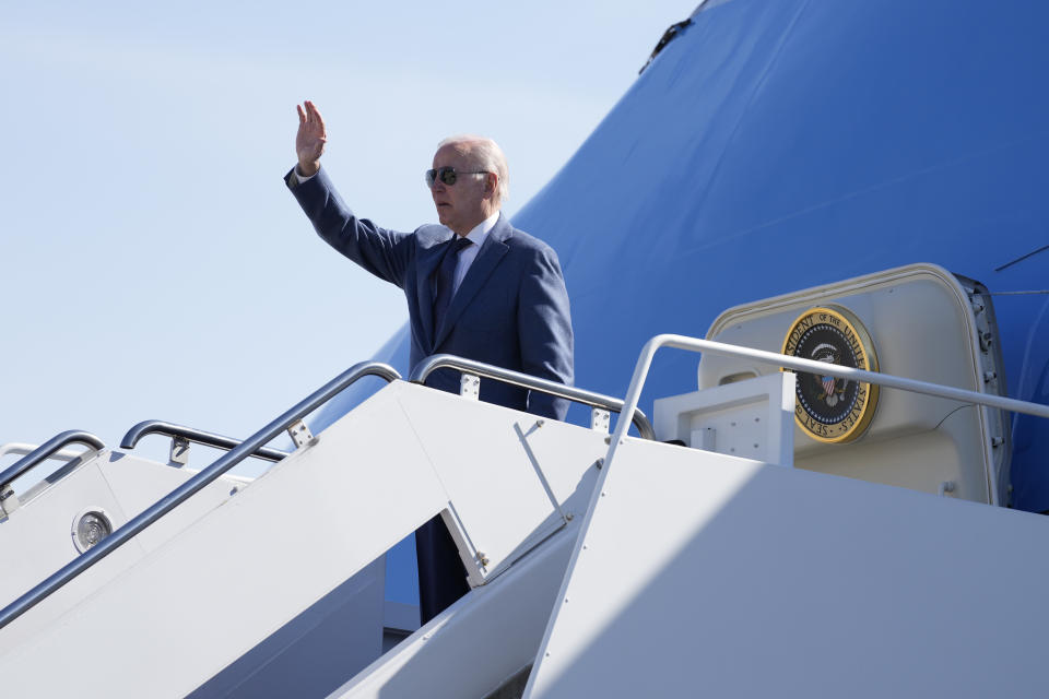 President Joe Biden waves as he boards Air Force One, Tuesday, April 11, 2023, at Andrews Air Force Base, Md. Biden is traveling the United Kingdom and Ireland in part to help celebrate the 25th anniversary of the Good Friday Agreement. (AP Photo/Patrick Semansky)