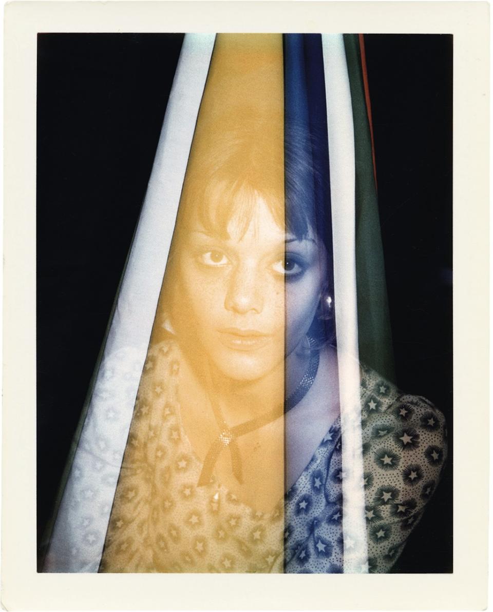 Brigid Berlin's double-exposure Polaroid portrait of Tina Aumont shows the actress filtered by colorful stripes.