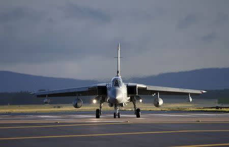 A Royal Air Force Tornado lands at RAF Lossiemouth in Scotland, December 2, 2015. REUTERS/Russell Cheyne