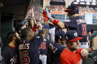 Washington Nationals' Ryan Zimmerman celebrates in the dugout after his home run during the second inning of Game 1 of the baseball World Series against the Houston Astros Tuesday, Oct. 22, 2019, in Houston.(AP Photo/Matt Slocum)