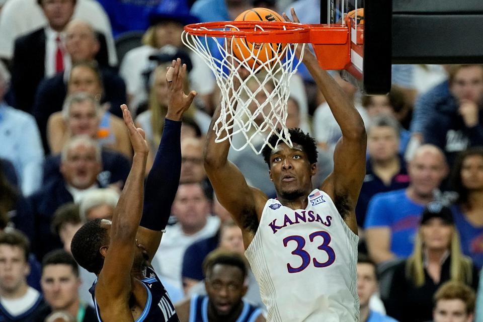 Kansas' David McCormack (33) shoots over Villanova's Eric Dixon during the first half of their Final Four game in the NCAA tournament on April 2, 2022, in New Orleans.