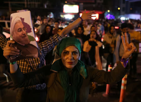 Supporters of Iranian president Hassan Rouhani celebrate his victory in the presidential election in Tehran, Iran, May 20, 2017. TIMA via REUTERS