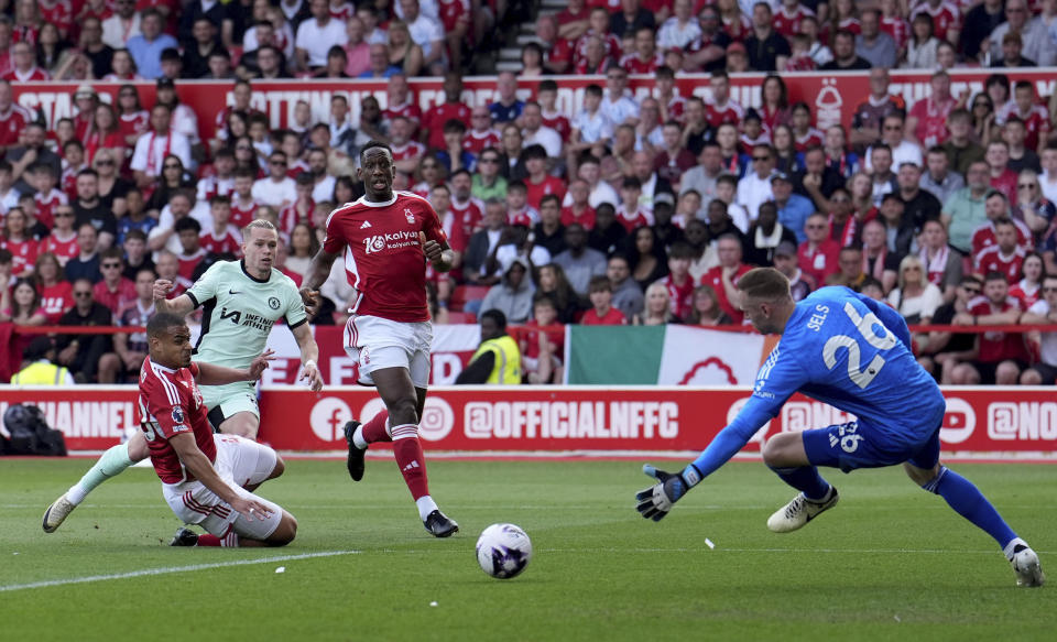 Chelsea's Mykhaylo Mudryk, second left, scores the opening goal during the English Premier League soccer match between Nottingham Forest and FC Chelsea in Nottingham, England, Saturday, May 11, 2024. (Martin Rickett/PA via AP)