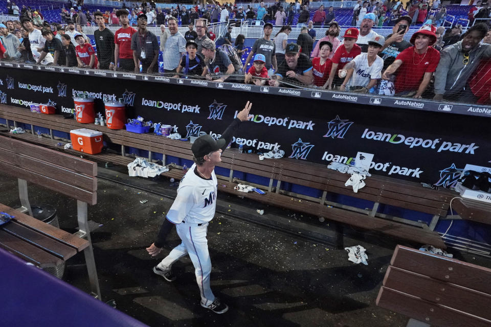 Miami Marlins manager Don Mattingly waves to the crowd after a baseball game against the Atlanta Braves, Wednesday, Oct. 5, 2022, in Miami. Don Mattingly won't be back next season. His contract expires after this season, and both sides agreed it is time for a new voice to lead the club. (AP Photo/Wilfredo Lee)