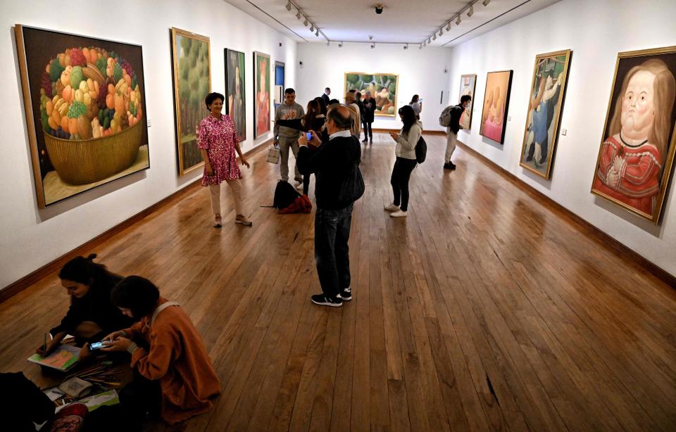 Visitors observe paintings by Colombian artist Fernando Botero at the Botero Museum in Bogota on Sept. 15, 2023.