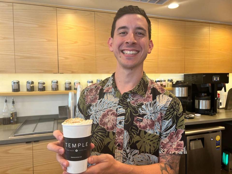 Temple Coffee launched its fall menu this week, featuring three customer favorites and a new one. Andrew Dong, 29, is shown here after making a Gingersnap Latte with oat milk, a returning drink for the season.