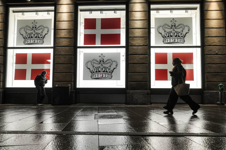 FILE - Department store windows display the Danish flag and the Danish crown in Copenhagen, Denmark, Saturday evening, Jan. 13, 2024. A closely watched survey shows that efforts to fight public-sector corruption are failing to progress around the world, with a decline in the functioning of justice systems contributing to the malaise. Denmark led the index for the sixth consecutive year, followed by Finland and New Zealand. At the other end, Somalia again placed last. (AP Photo/Martin Meissner, File)