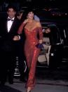 <p>Filming a scene for <em>The Player</em> with Peter Gallagher in a red sequin gown and tassel earrings. </p>