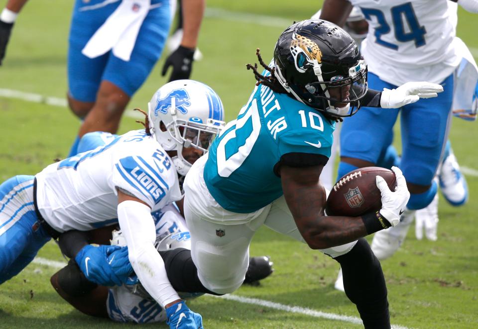 Jacksonville Jaguars receiver Laviska Shenault Jr. is tackled by Detroit Lions cornerback Darryl Roberts during the first quarter at TIAA Bank Field, Oct. 18, 2020.