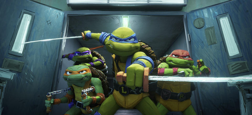 This image released by Paramount Pictures shows, from left, Michelangelo, "Mikey," voiced by Shamon Brown Jr., Donatello "Donnie," voiced by Micah Abbey, background left, Leonardo "Leo", voiced by Nicolas Cantu, and Raphael "Raph", voiced by Brady Noon, (Paramount Pictures via AP)