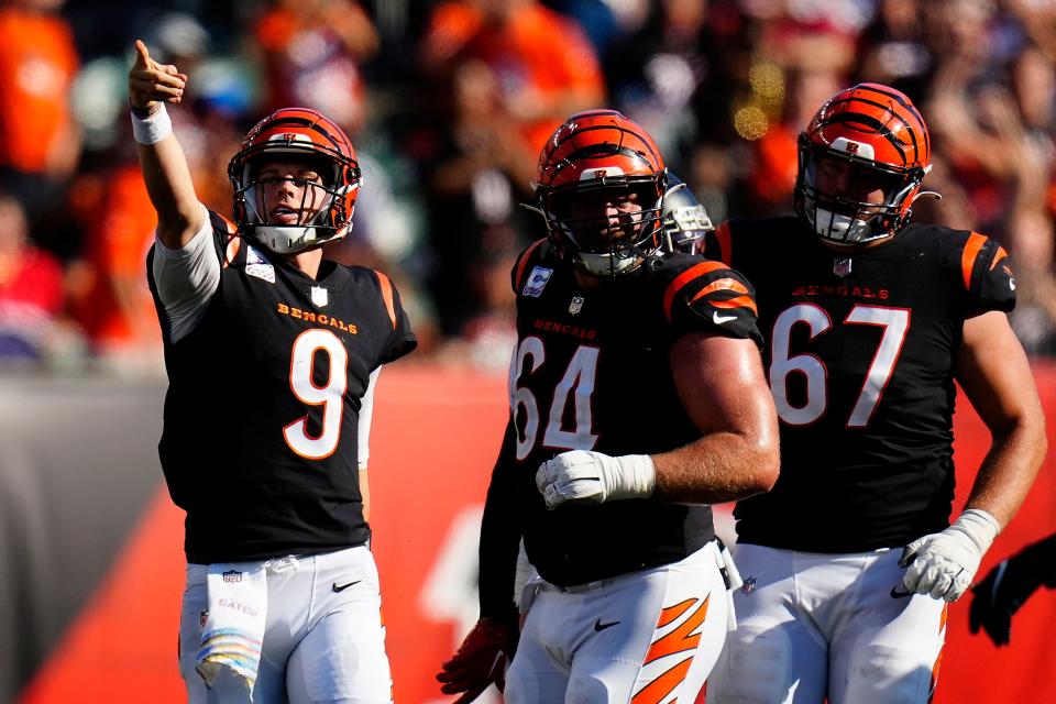 Joe Burrow celebrates a first down against the Falcons.