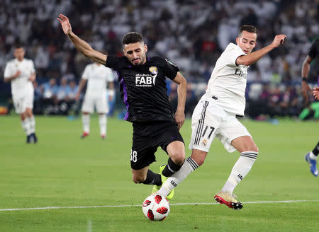 Soccer Football - Club World Cup - Final - Real Madrid v Al Ain - Zayed Sports City Stadium, Abu Dhabi, United Arab Emirates - December 22, 2018 Al-Ain's Yahia Nader in action with Real Madrid's Lucas Vazquez REUTERS/Suhaib Salem