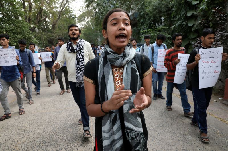 Students shout slogans during a protest against the alleged rape and murder of a 27-year-old woman, in Kolkata