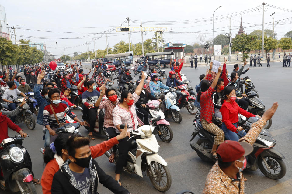 Protesters on motorcycles flash three-fingered salutes during a protest rally in Mandalay, Myanmar, on Feb. 6, 2021. Protests in Myanmar against the military coup that removed Aung San Suu Kyi’s government from power have grown in recent days despite official efforts to make organizing them difficult or even illegal. (AP Photo)