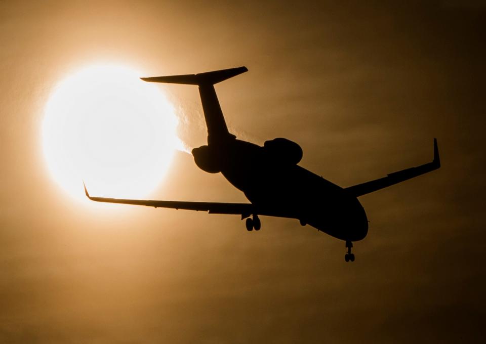 An airplane approaches South Bend International Airport as it prepares to land in this file photo. Tribune Photo/ROBERT FRANKLIN