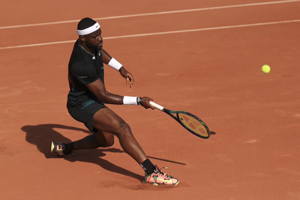 FILE - Frances Tiafoe of the U.S. plays a shot against Serbia's Filip Krajinovic during their first round match of the French Open tennis tournament at the Roland Garros stadium in Paris, May 29, 2023. The group that runs the French Open tennis tournament has hired an artificial intelligence company to monitor players' social media accounts in a bid to try to protect athletes from cyberbullying. (AP Photo/Aurelien Morissard, File)