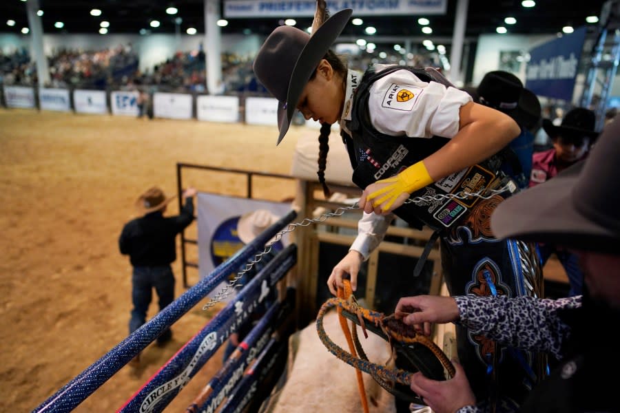 <em>Najiah Knight prepares to ride a bull during the Junior World Finals rodeo, Thursday, Dec. 7, 2023, in Las Vegas. Najiah, a high school junior from small-town Oregon, is on a yearslong quest to become the first woman to compete at the top level of the Professional Bull Riders tour. (AP Photo/John Locher)</em>