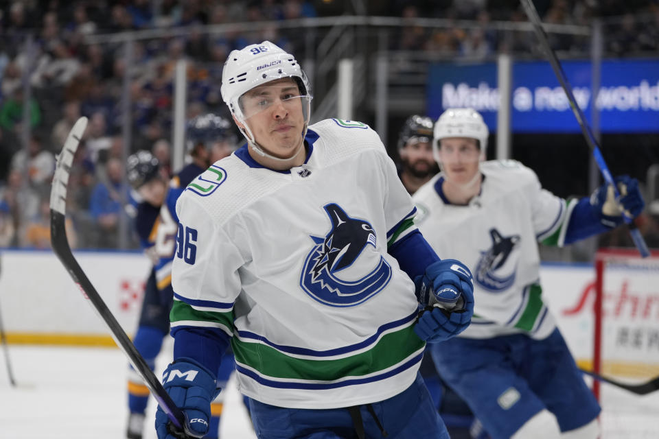 Vancouver Canucks' Andrei Kuzmenko celebrates after scoring during the third period of an NHL hockey game against the St. Louis Blues Tuesday, March 28, 2023, in St. Louis. (AP Photo/Jeff Roberson)