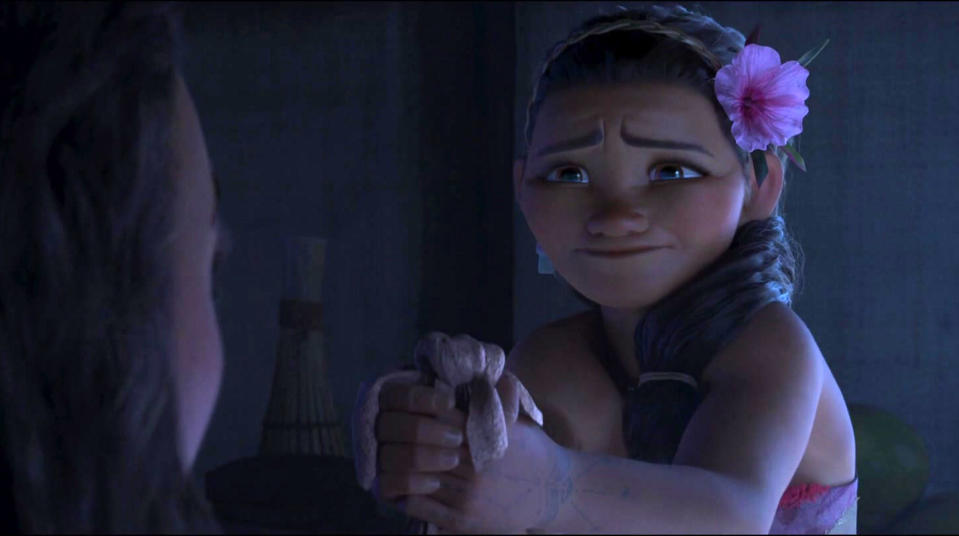 Moana's mother handing Moana a bag with tears in her eyes