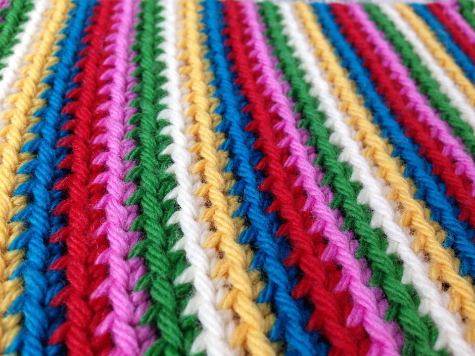 In this handout photo provided by Edie Eckman, rounds of single crochet were worked in the back loops to create colorful stripes. Today’s crochet is leaner and trendier than that of the 1960s and ’70s, from which we know it for its bulky, acrylic yarns and Afghan blankets. (AP Photo/Edie Eckman, Edie Eckman)