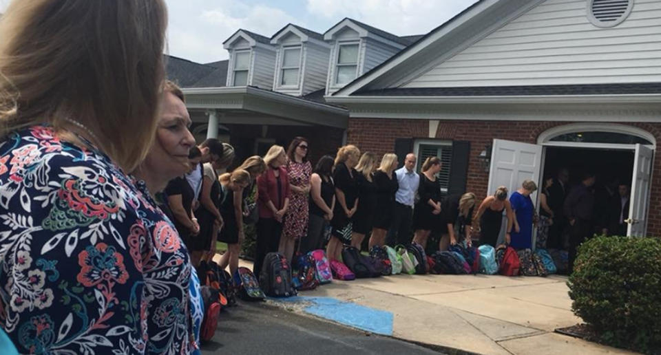 Teachers carried the backpacks back to their schools. (Photo: Brad Johnson via Twitter)