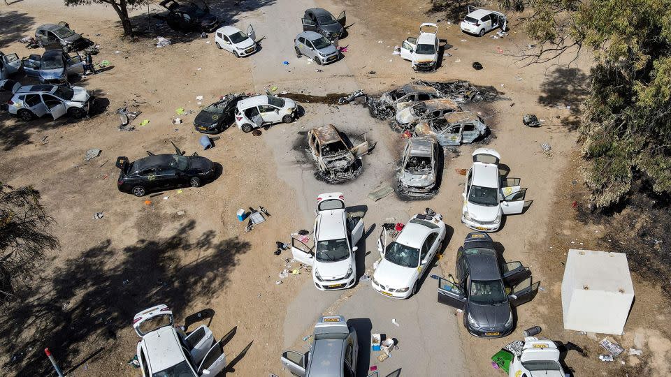 This aerial image shows abandoned and burned-out vehicles at the site of the October 7 attack on a music festival in southern Israel, October 13, 2023. - Jack Guez/AFP/Getty Images